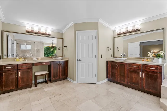 a spacious bathroom with a double vanity sink and a mirror