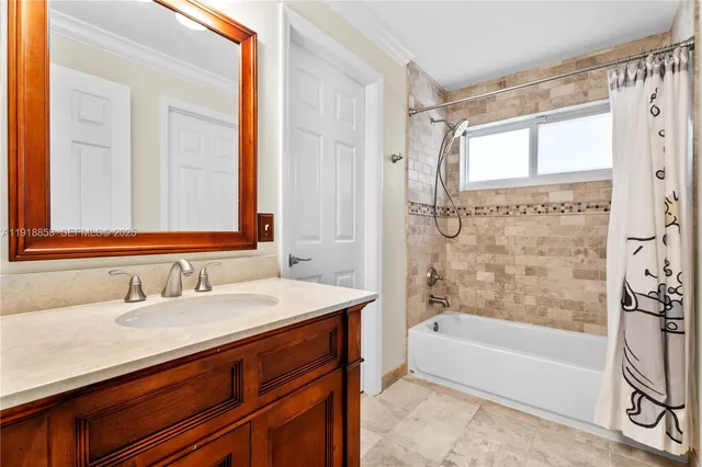 a bathroom with a sink mirror toilet and bathtub