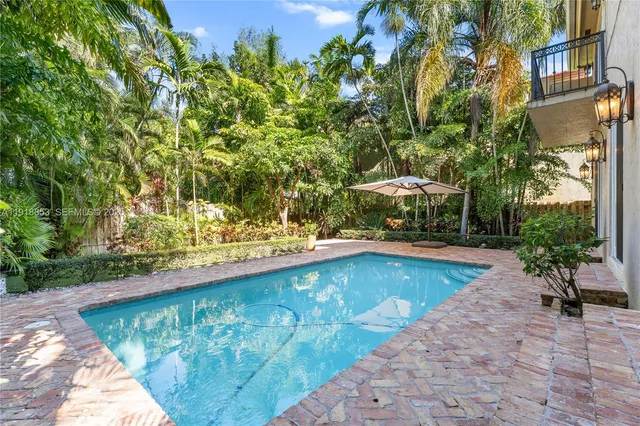 a view of a swimming pool with a patio