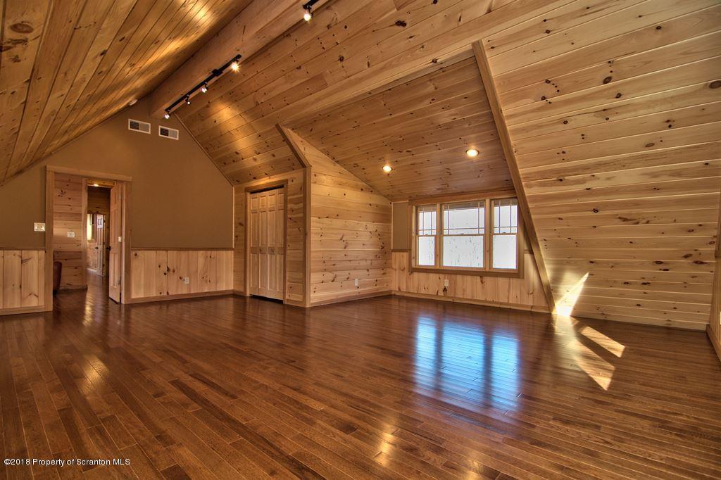 110 Highland Road Moscow, PA 18444 - Photo 17 of 88 a view of empty room with wooden floor
