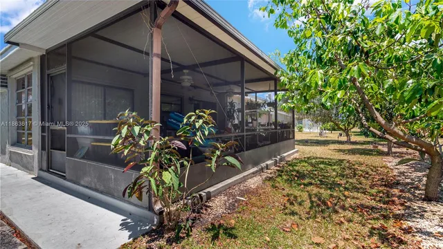 a view of a porch with potted plants