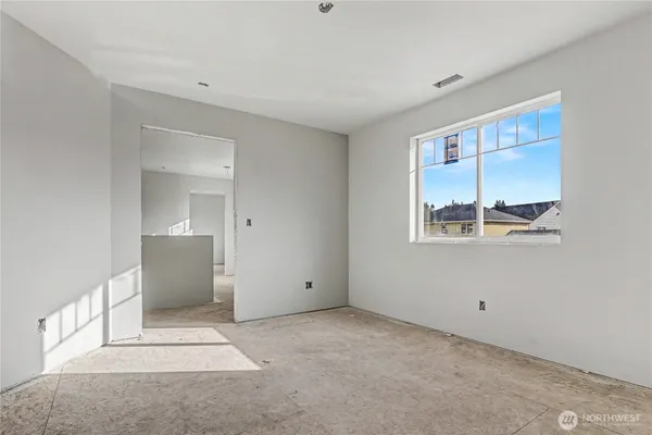 a view of room with window and cabinet