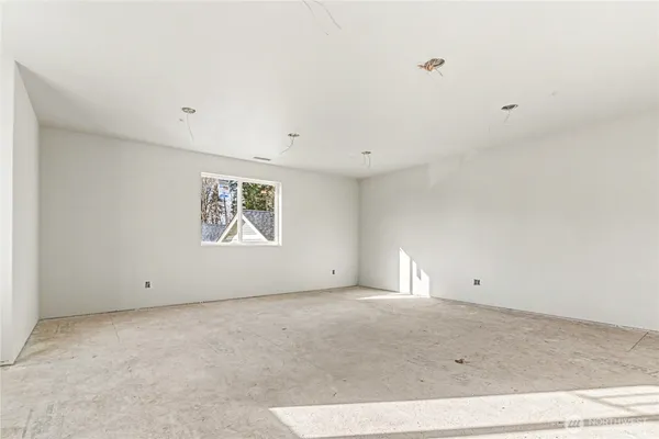 an empty room with white walls