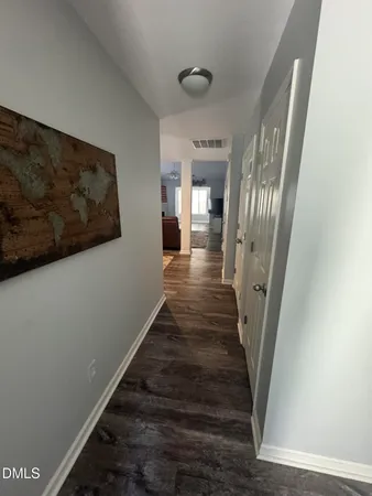 a view of a dining room with furniture and window