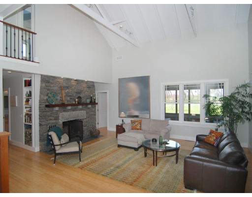 226 West Main Road Little Compton, RI 02837 - Photo 2 of 8 a living room with furniture and a fireplace