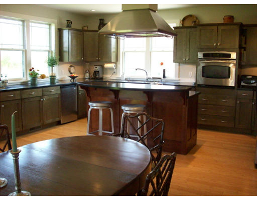 226 West Main Road Little Compton, RI 02837 - Photo 4 of 8 a kitchen with stainless steel appliances granite countertop a sink a stove and a microwave