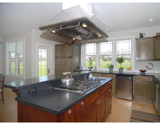 226 West Main Road Little Compton, RI 02837 - Photo 6 of 8 a kitchen with a counter space a sink a window and chairs