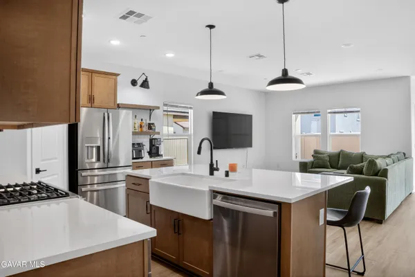 a kitchen with refrigerator cabinets and furniture