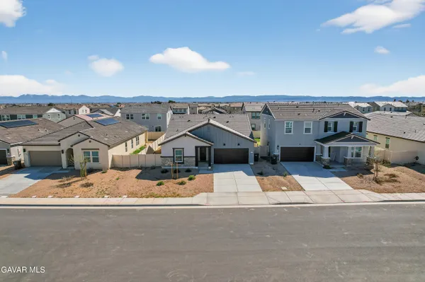 an aerial view of a house with a outdoor space