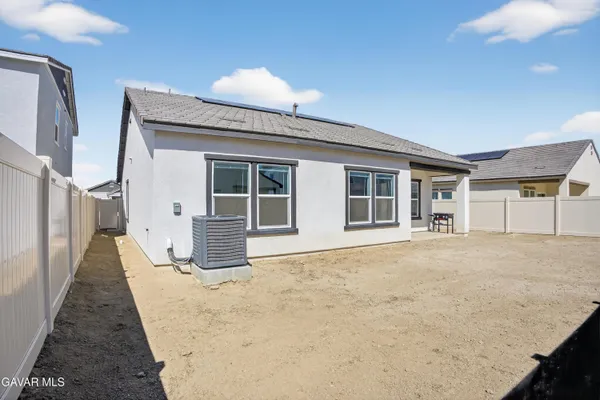 a view of a backyard of a house
