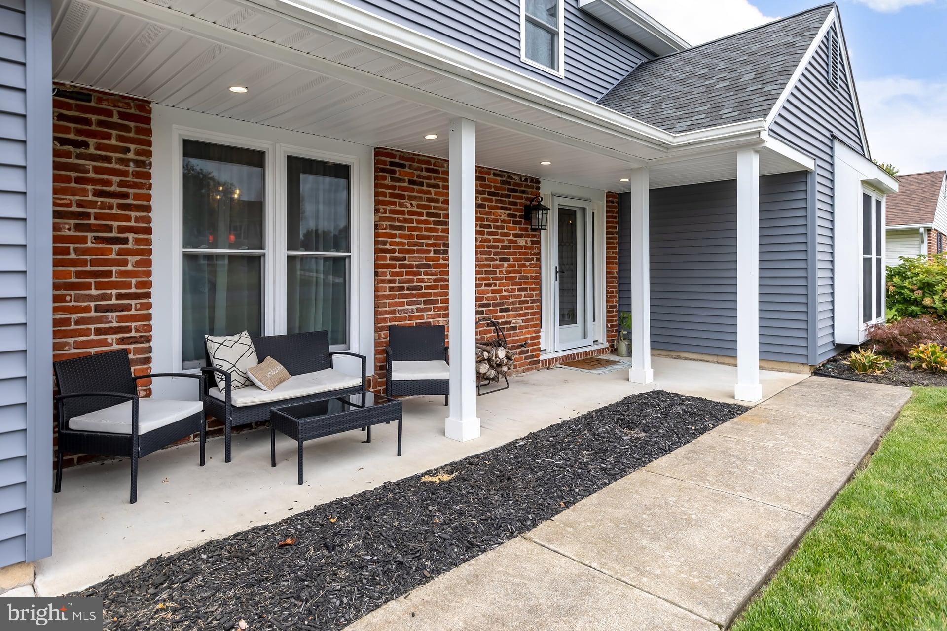 38 Freedom Road Sewell, NJ 08080 - Photo 4 of 24 a balcony with furniture and a potted plant