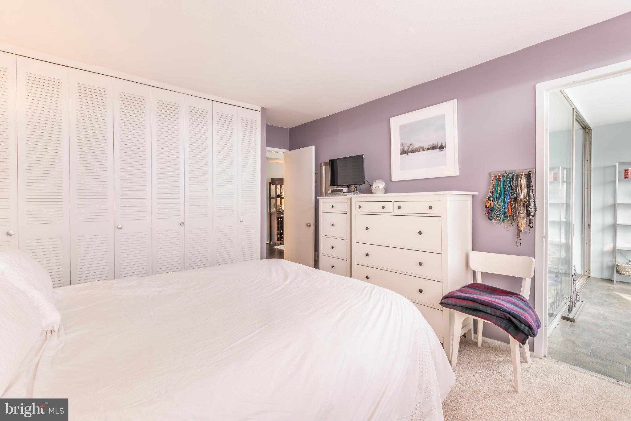 1301 Delaware Avenue Southwest, Unit N816 Washington, DC 20024 - Photo 12 of 20 a bedroom with a bed and a dresser