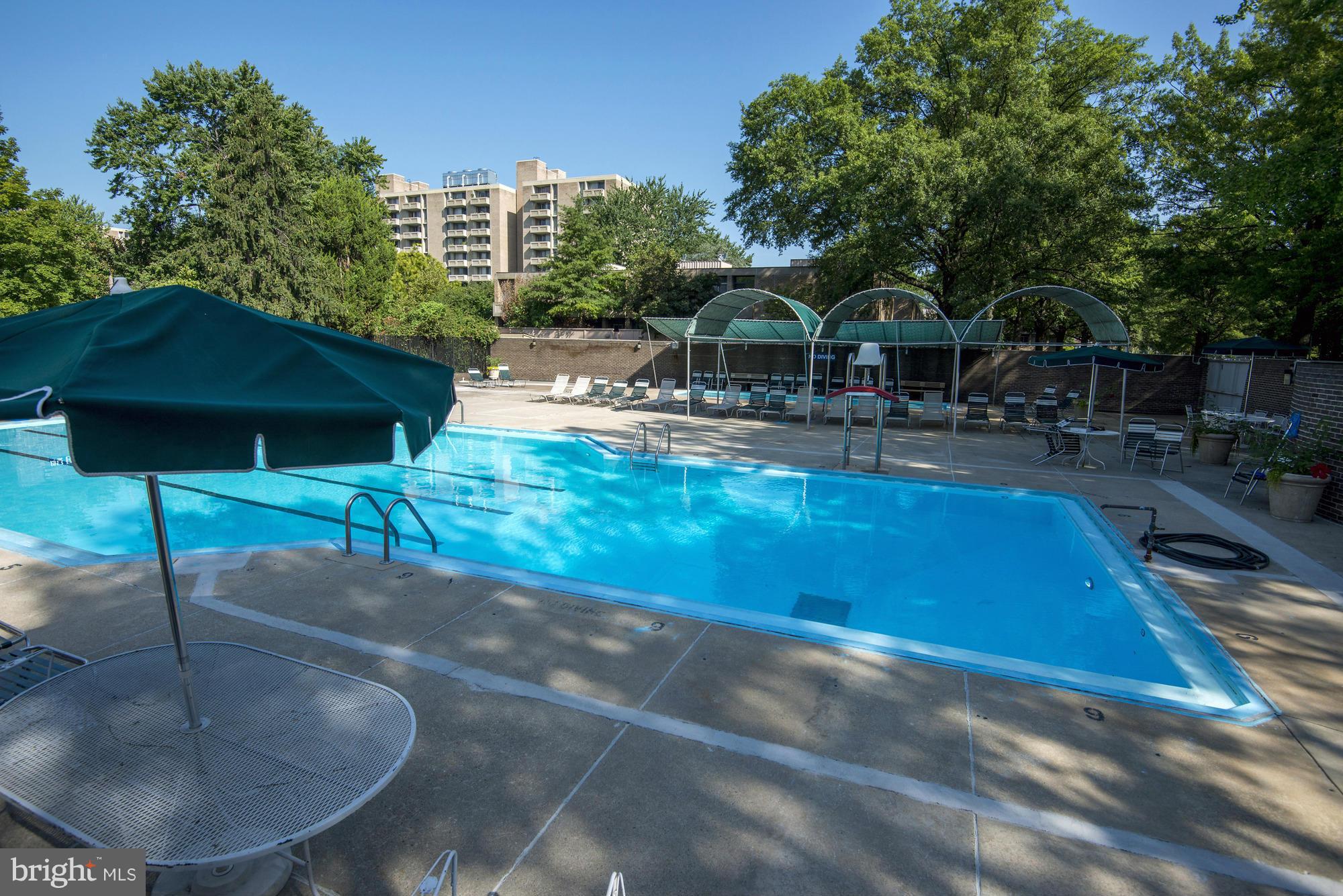 1301 Delaware Avenue Southwest, Unit N816 Washington, DC 20024 - Photo 15 of 20 a swimming pool with outdoor seating and yard
