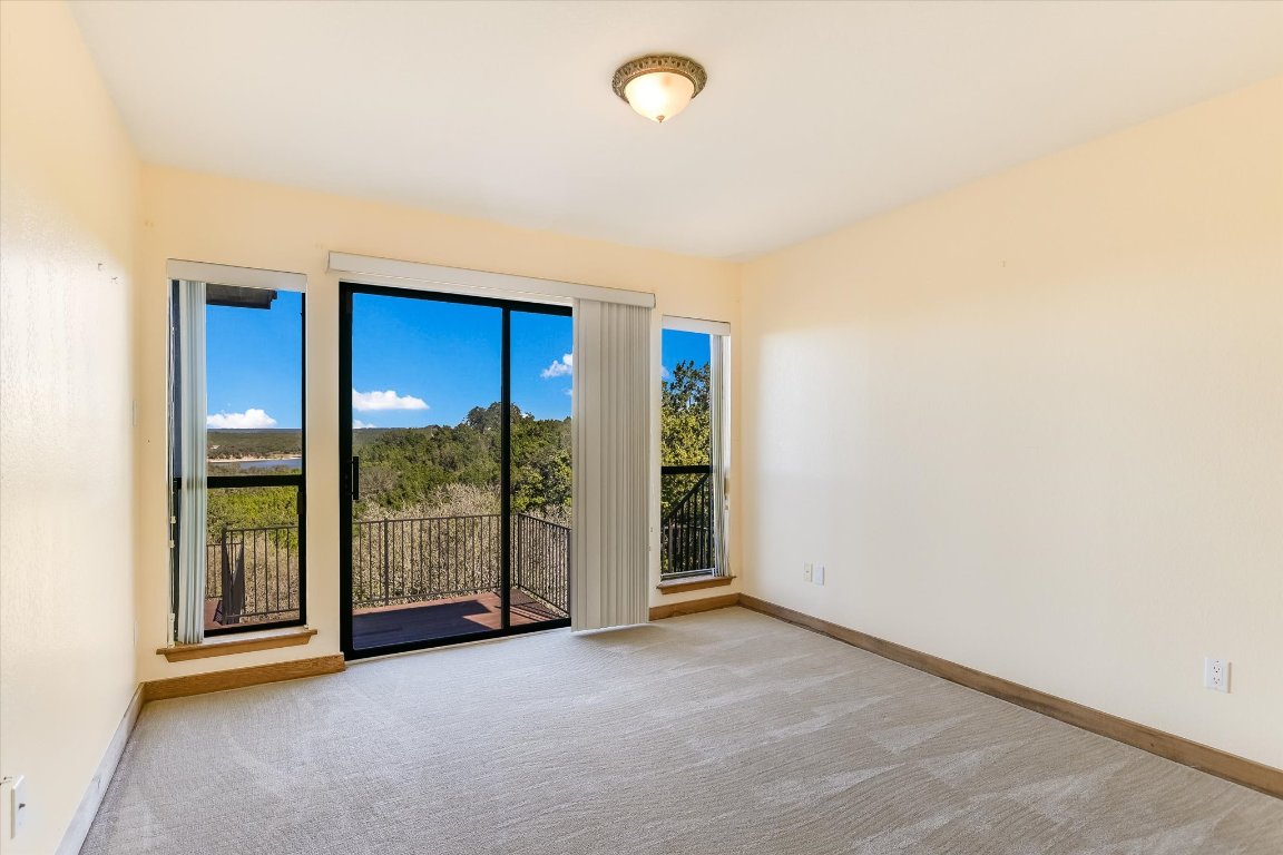 116 Courtside Way Spicewood, TX 78669 - Photo 20 of 40 an empty room with sliding door