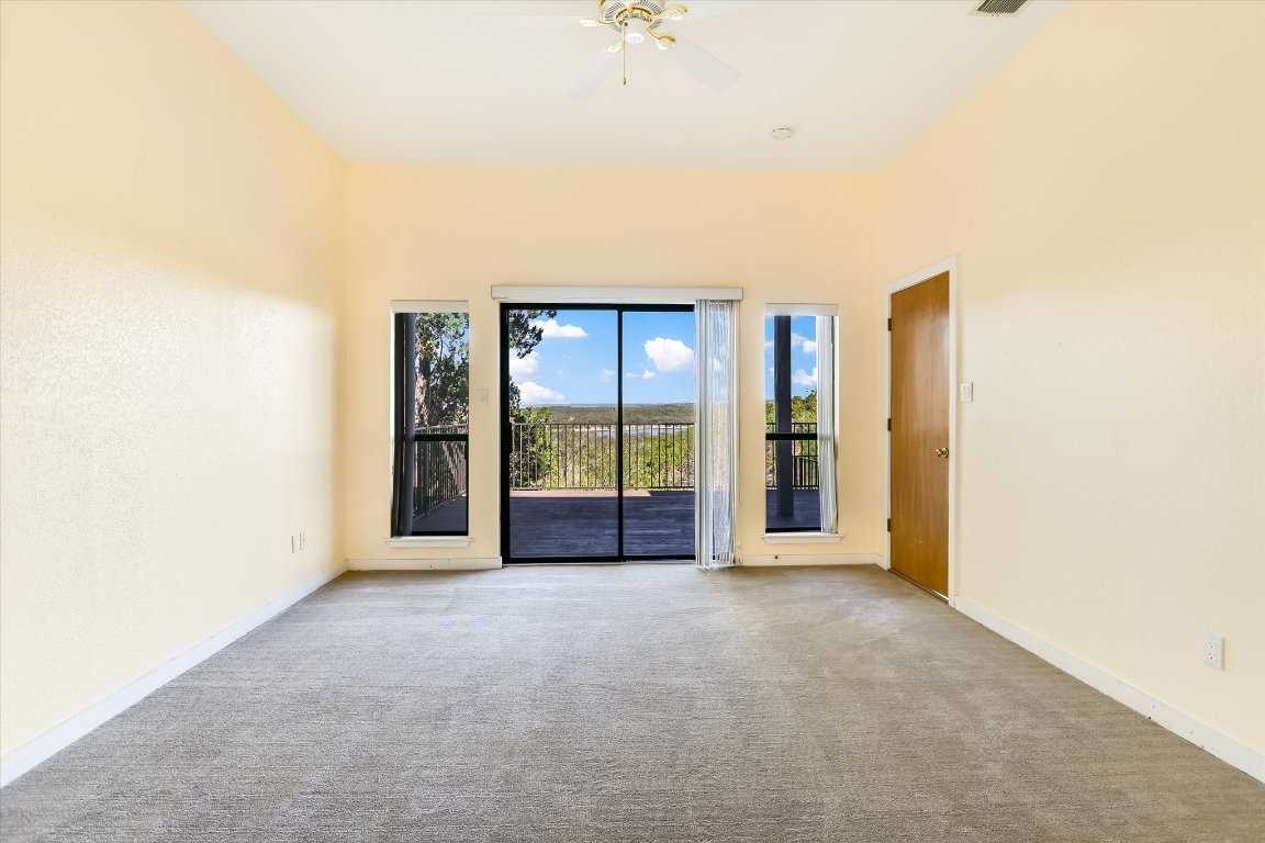 116 Courtside Way Spicewood, TX 78669 - Photo 22 of 40 a view of an empty room with a window