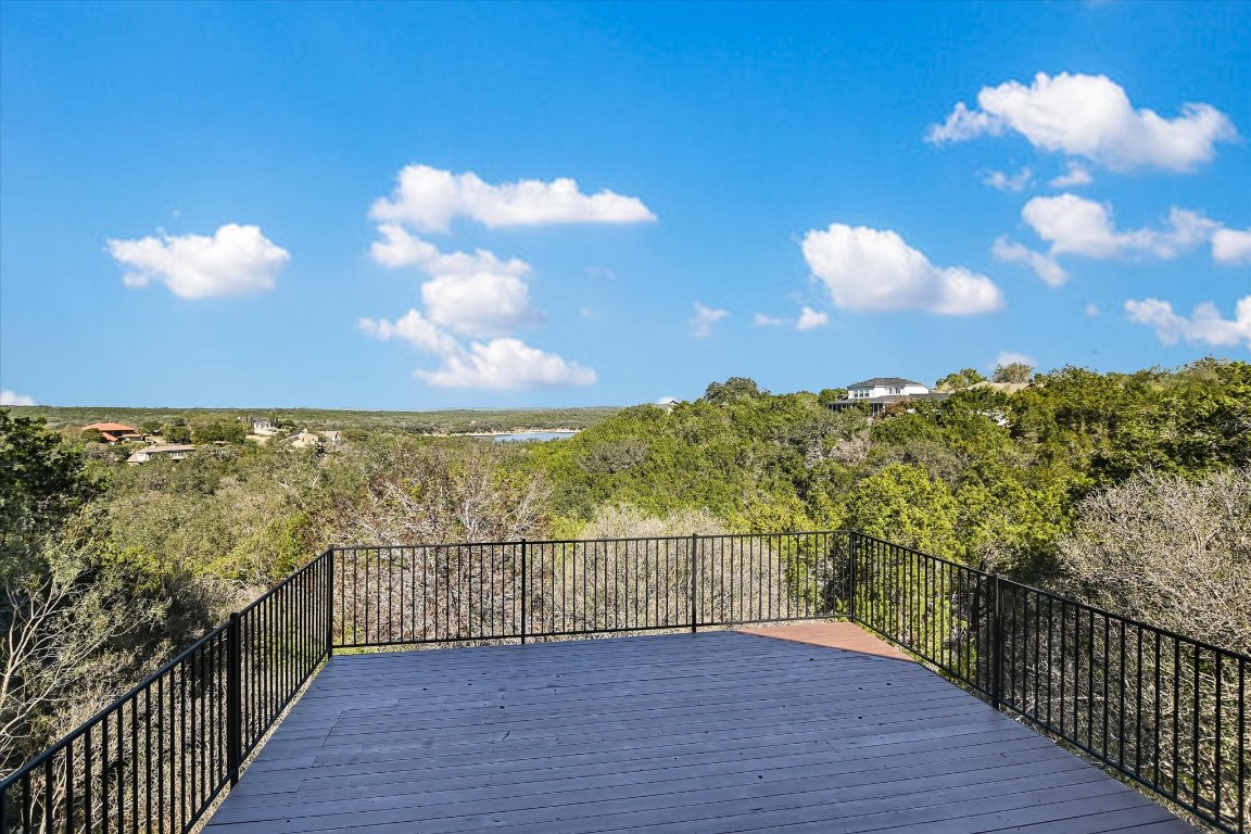 116 Courtside Way Spicewood, TX 78669 - Photo 25 of 40 a view of a balcony with wooden floor