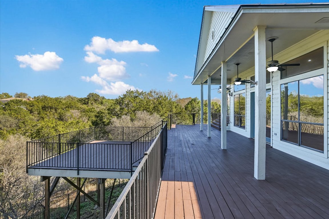 116 Courtside Way Spicewood, TX 78669 - Photo 7 of 40 a view of a balcony with wooden floor and outdoor space