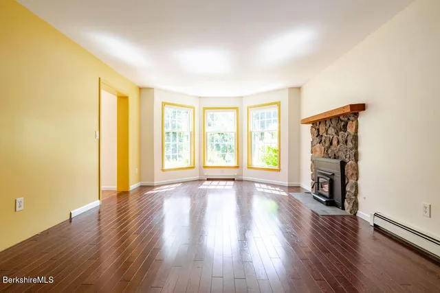 a front view of a house with a yard table and chairs