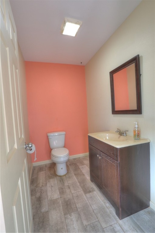 3141 Baybrook Drive Corpus Christi, TX 78418 - Photo 13 of 32 a bathroom with a toilet sink and mirror