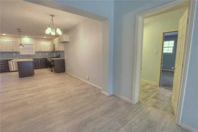 a view of a kitchen and a chandelier