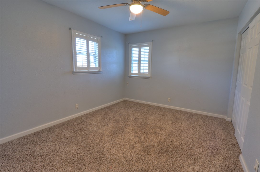 3141 Baybrook Drive Corpus Christi, TX 78418 - Photo 29 of 32 an empty room with windows and fan