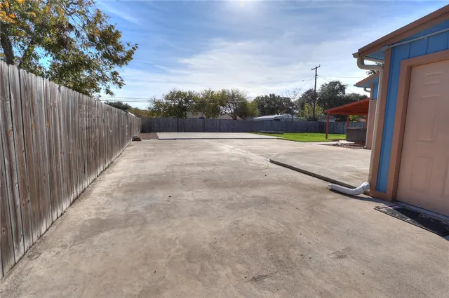 a view of a backyard of the house