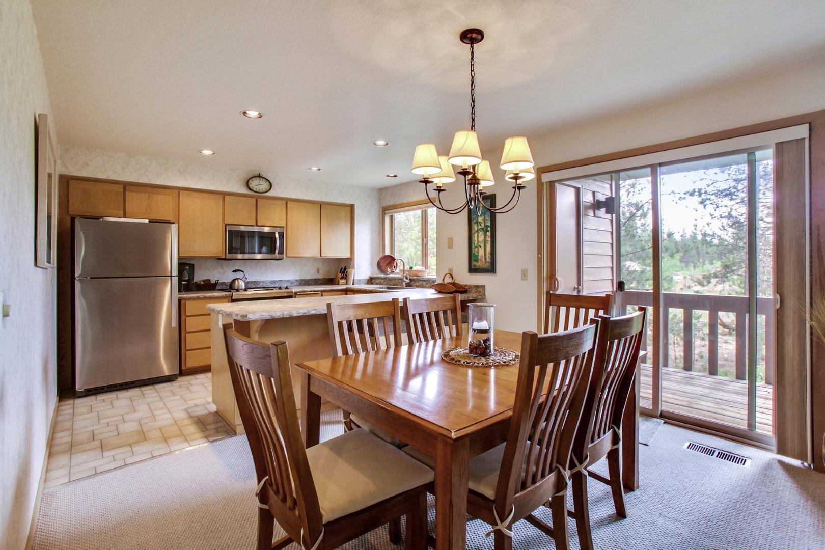 57321 Beaver Ridge Loop, Unit 1 Sunriver, OR 97707 - Photo 5 of 28 R1 dining room to kitchen