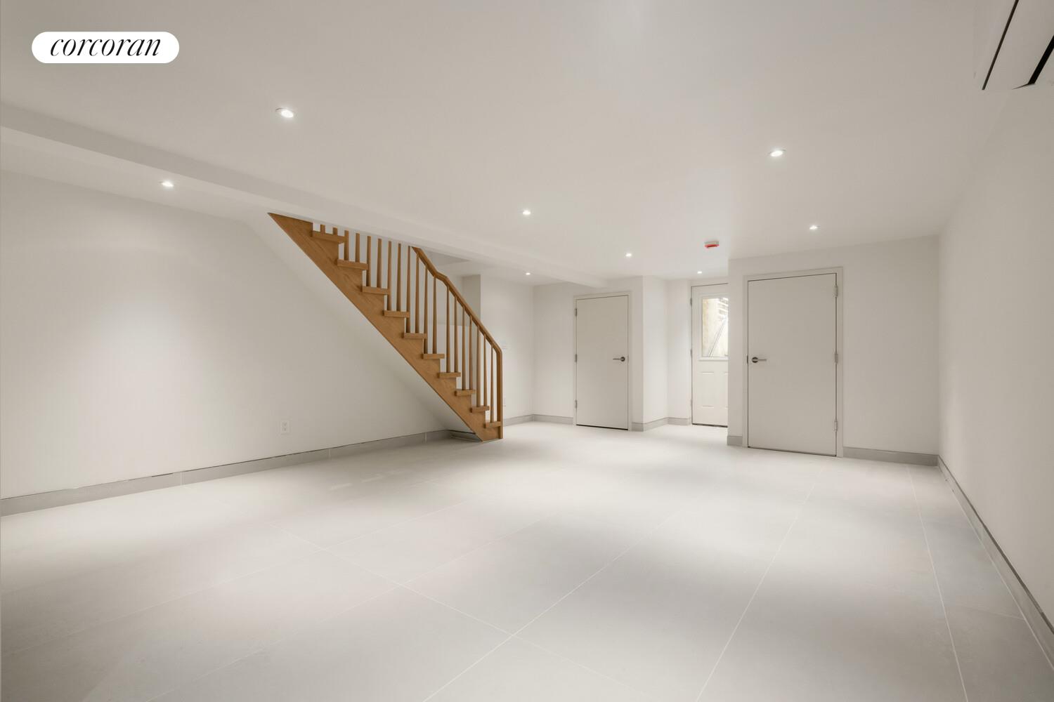 700 Monroe Street Brooklyn, NY 11221 - Photo 16 of 18 a view of an empty room with stairs