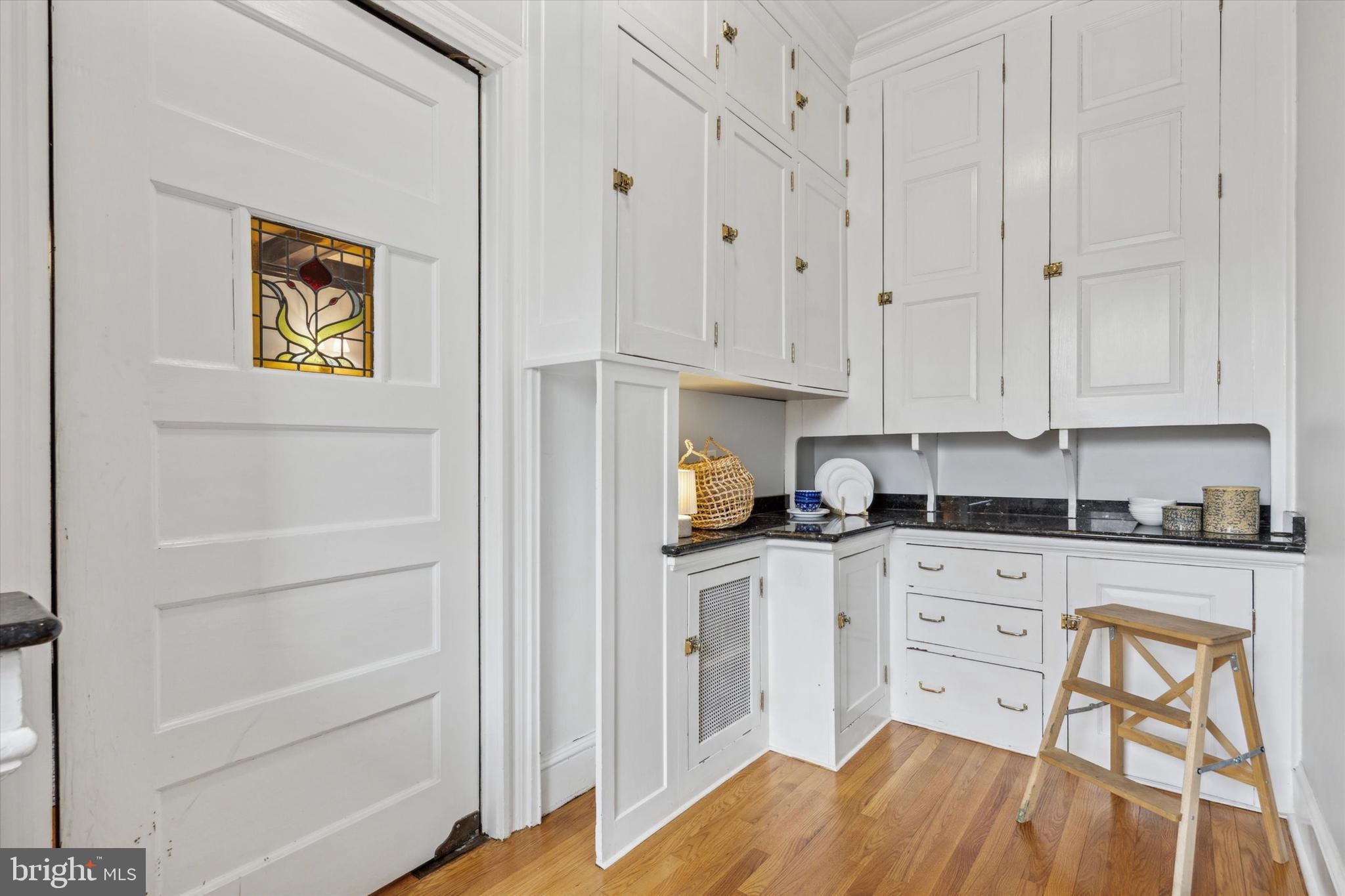 226 Fishers Road Bryn Mawr, PA 19010 - Photo 13 of 60 a kitchen with stainless steel appliances white cabinets and a stove top oven