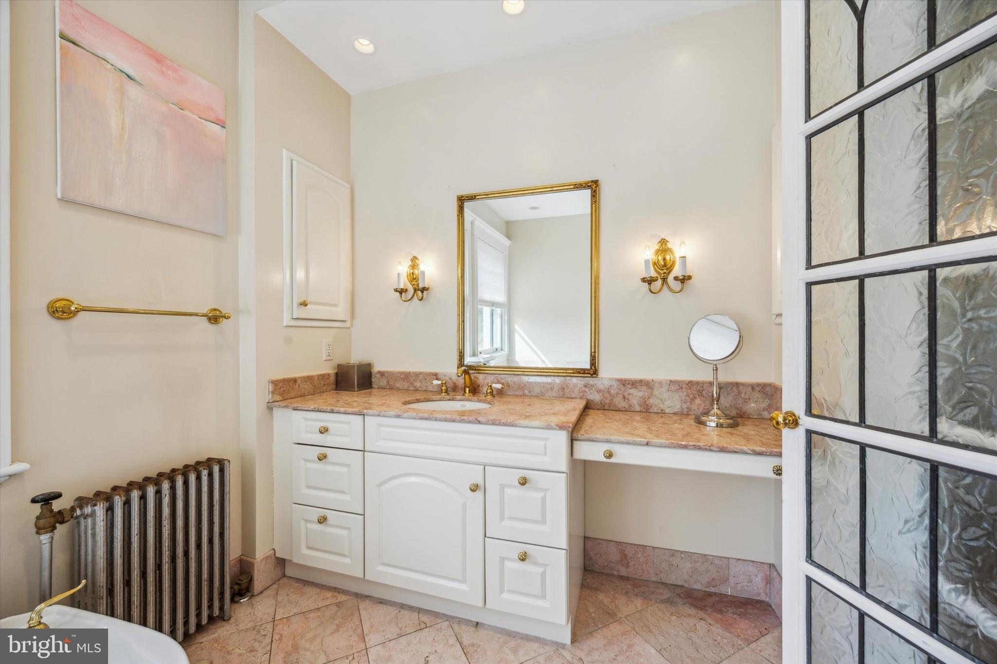 226 Fishers Road Bryn Mawr, PA 19010 - Photo 27 of 60 a spacious bathroom with a double vanity sink and a mirror
