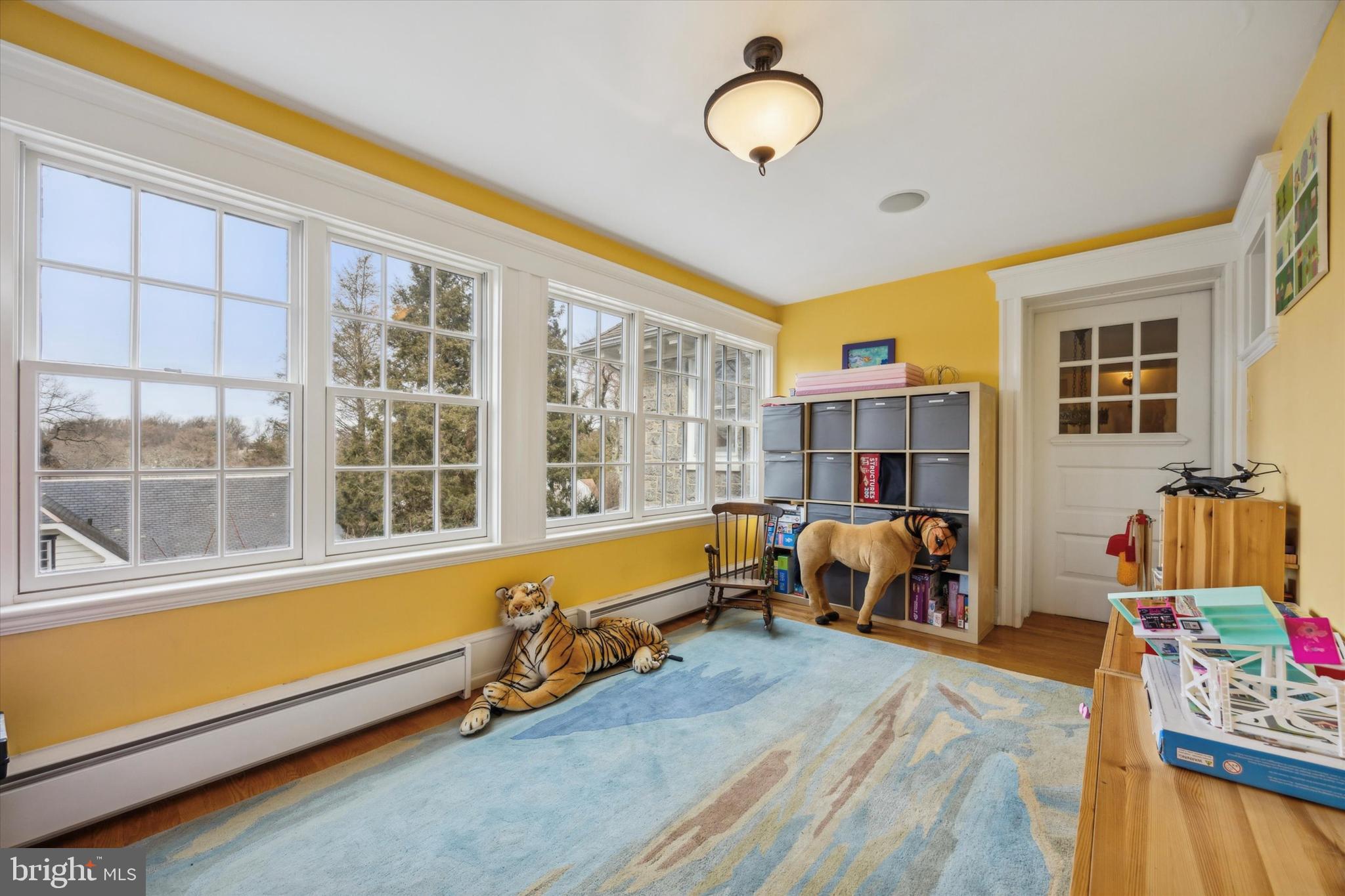 226 Fishers Road Bryn Mawr, PA 19010 - Photo 33 of 60 a living room filled with furniture and a large window
