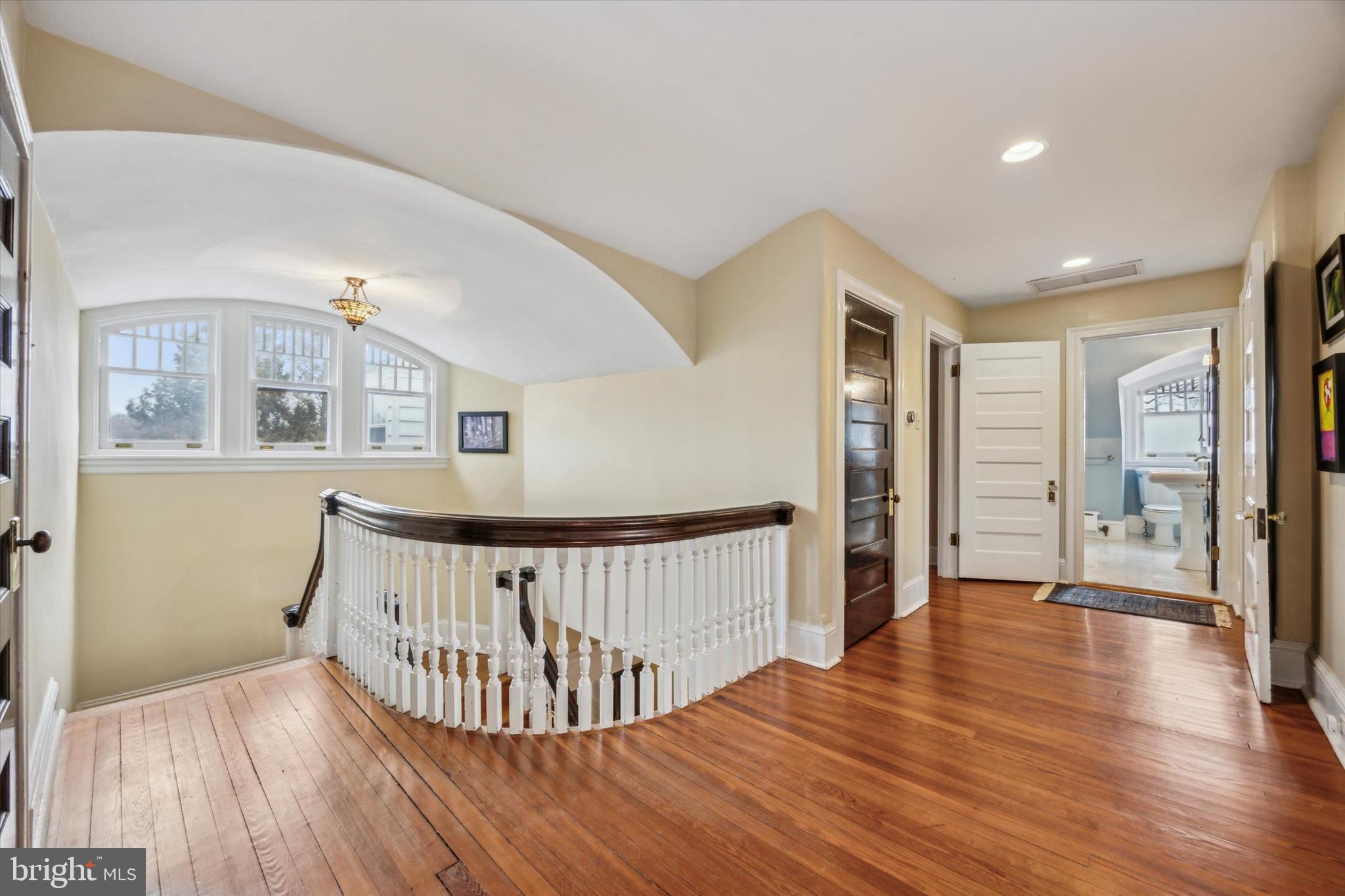 226 Fishers Road Bryn Mawr, PA 19010 - Photo 34 of 60 a view of a hallway with wooden floor and windows
