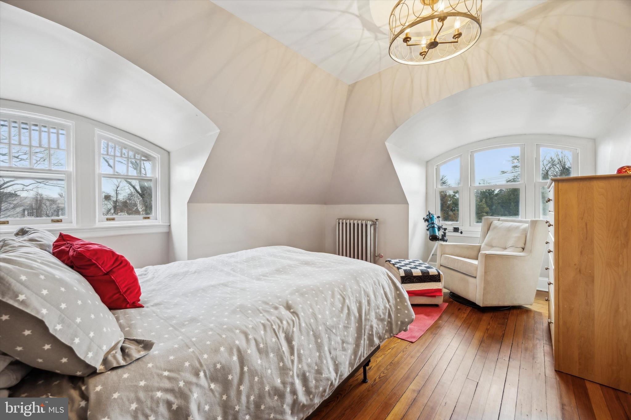 226 Fishers Road Bryn Mawr, PA 19010 - Photo 37 of 60 a bedroom with a bed and wooden floor