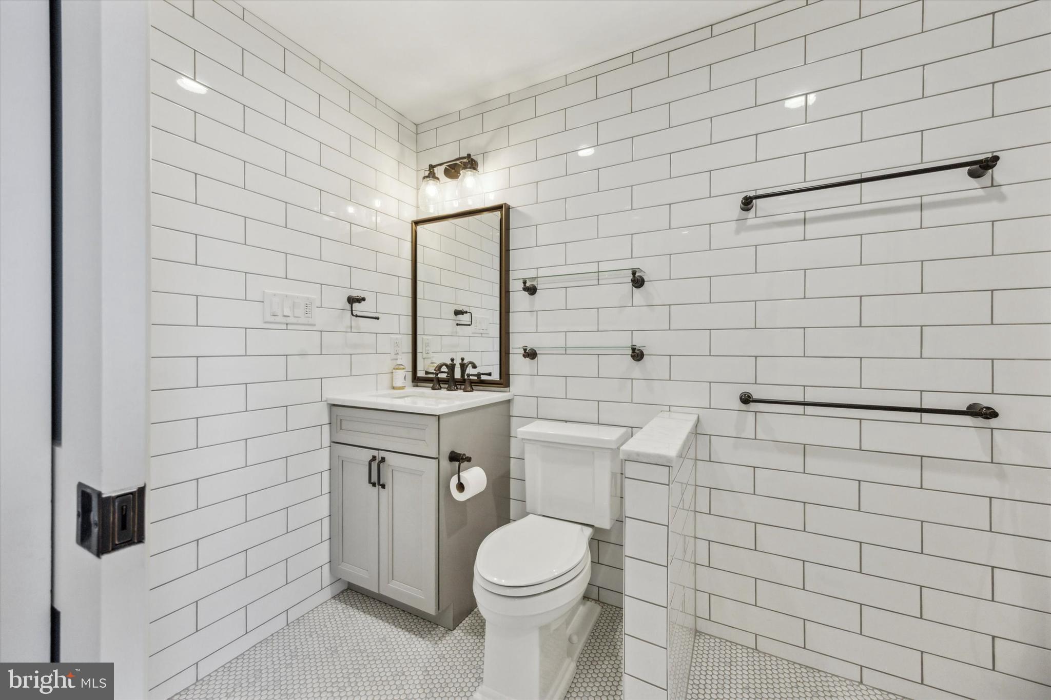 226 Fishers Road Bryn Mawr, PA 19010 - Photo 46 of 60 a bathroom with a toilet and a sink