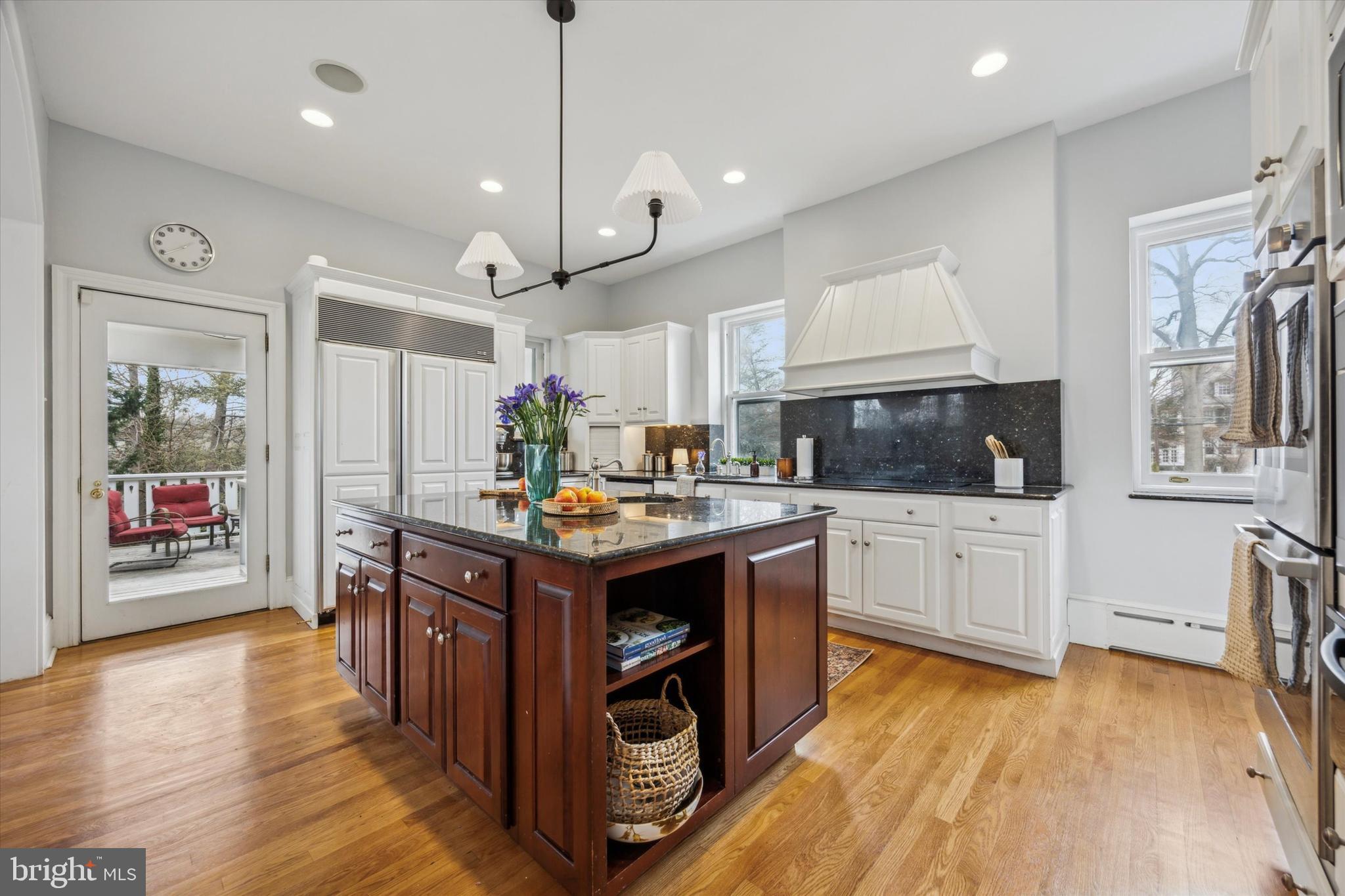 226 Fishers Road Bryn Mawr, PA 19010 - Photo 9 of 60 a kitchen with kitchen island granite countertop a stove oven and a refrigerator