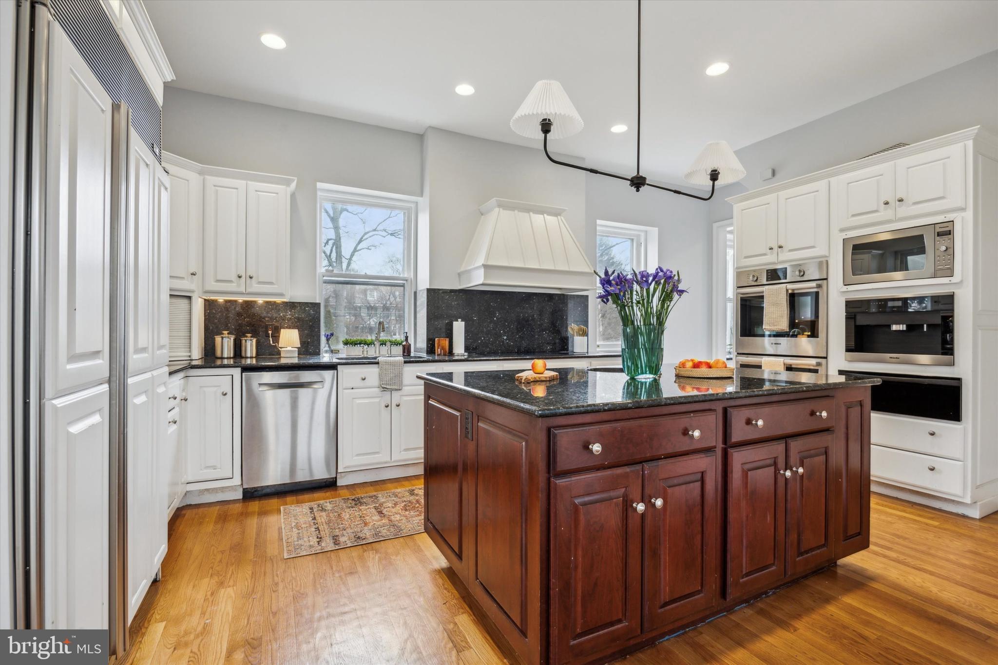226 Fishers Road Bryn Mawr, PA 19010 - Photo 10 of 60 a kitchen with stainless steel appliances granite countertop a stove a sink and a refrigerator