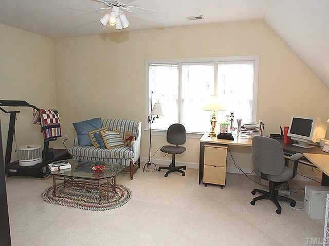 7709 Wilderness Road Raleigh, NC 27613 - Photo 6 of 8 a workspace with a window