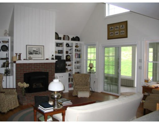 34 Shattuck Street Groton, MA 01450 - Photo 8 of 10 a living room with furniture and a fireplace