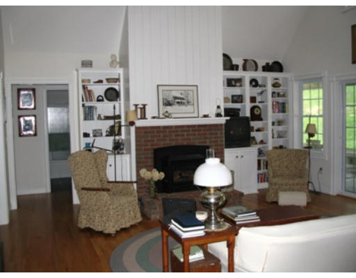 34 Shattuck Street Groton, MA 01450 - Photo 9 of 10 a living room with furniture and a fireplace