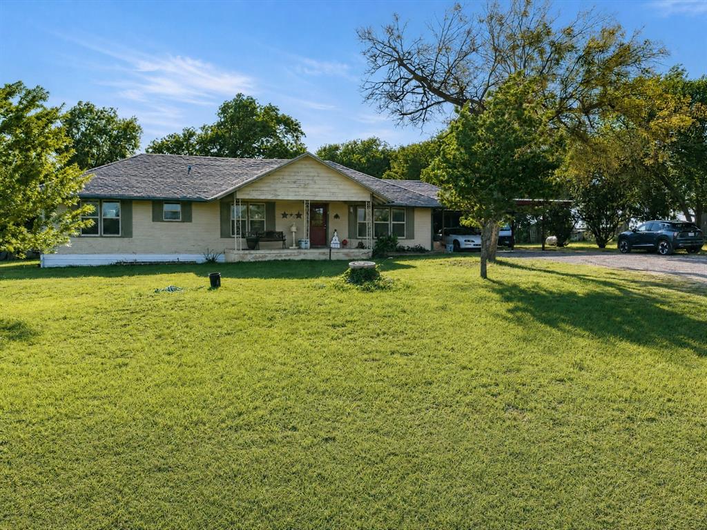 301 Ovilla Road Waxahachie, TX 75167 - Photo 2 of 38 a view of a swimming pool with a garden