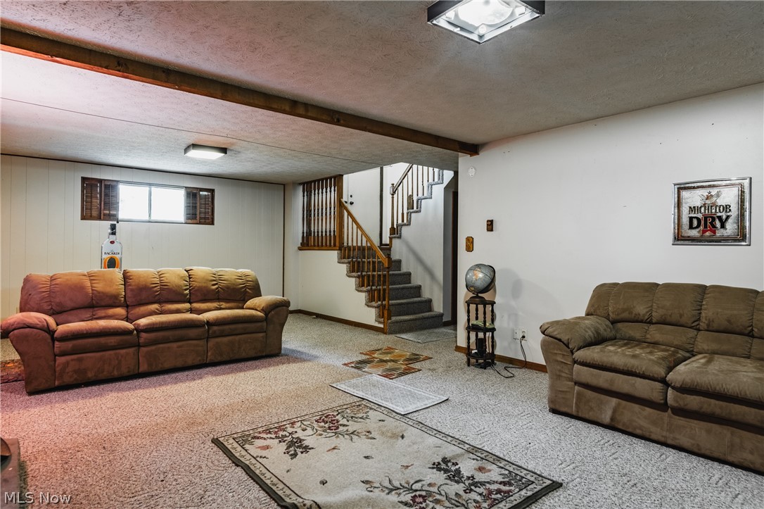 279 Spence Road Belpre, OH 45714 - Photo 26 of 40 Carpeted living room with a textured ceiling