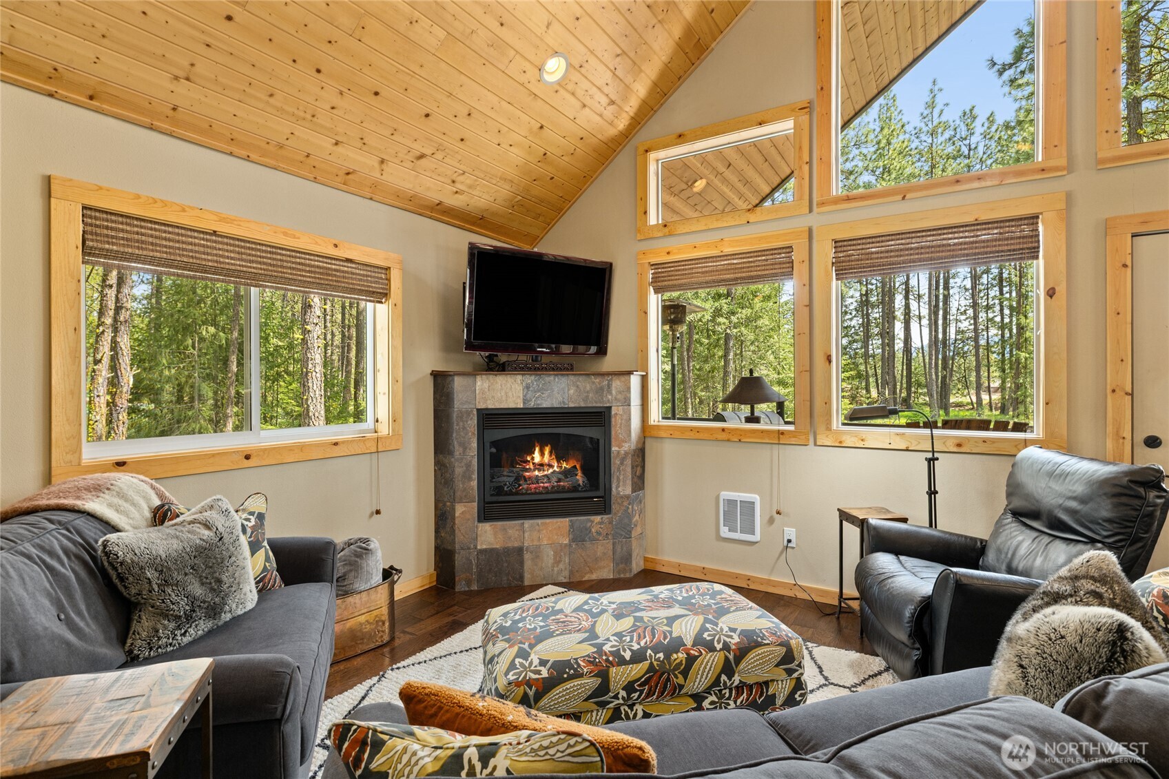 910 Bakers Road Ronald, WA 98940 - Photo 15 of 34 a living room with furniture a flat screen tv and a fireplace