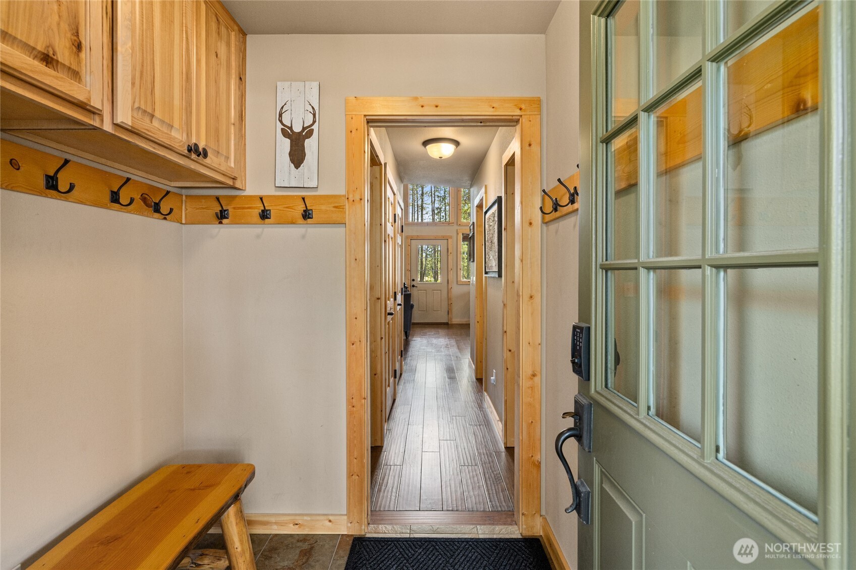 910 Bakers Road Ronald, WA 98940 - Photo 10 of 34 a view of a hallway with wooden floor and staircase