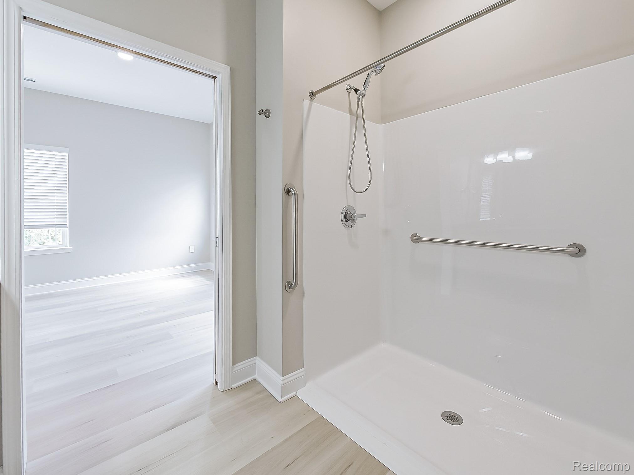 31480 Warren Road, Unit 101 Westland, MI 48185 - Photo 15 of 26 Full bath featuring a shower and light wood-style floors