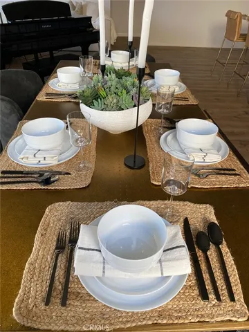 a dining room with a table and chairs