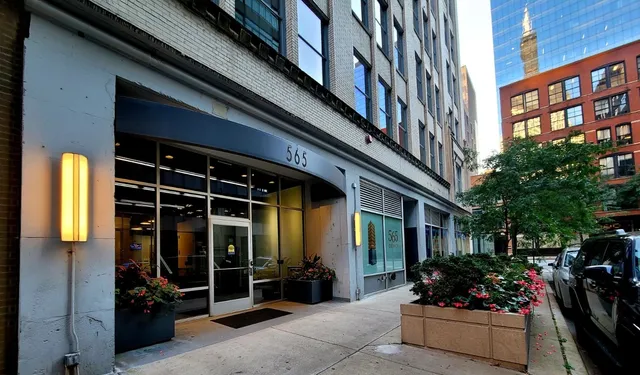 a view of a building with sitting area