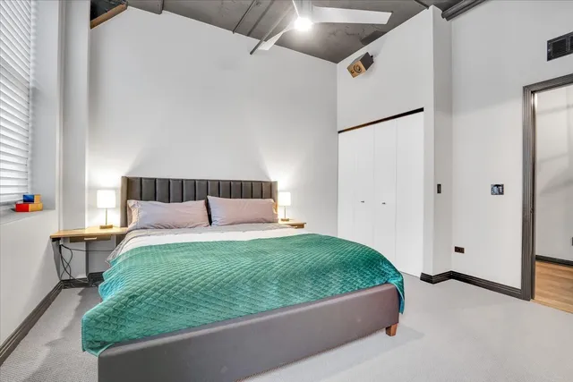 a bedroom with a bed and window