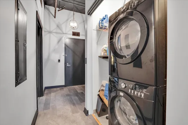 a view of a hallway with washer and dryer