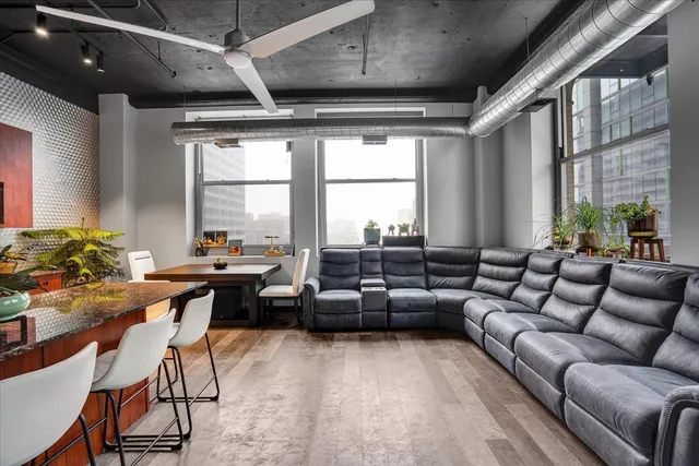 a living room with furniture and a large window