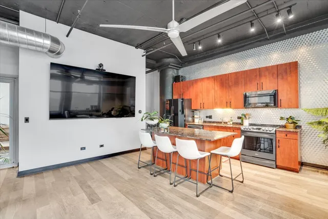 a view of a kitchen with a sink and microwave